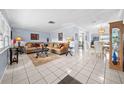 Bright living room with tiled floors and a comfortable sofa at 11095 56Th N Ave, Seminole, FL 33772