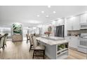 Spacious kitchen with island, white cabinets, and marble countertops at 2322 Riverbluff Pkwy # V250, Sarasota, FL 34231