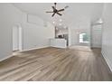 Open-concept living room with hardwood floors and high ceilings at 4782 Lummus St, North Port, FL 34286