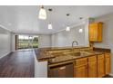 Kitchen with granite countertops, stainless steel appliances, and golf course view at 2400 Feather Sound Dr # 613, Clearwater, FL 33762