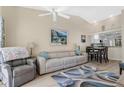 Relaxing living room with comfortable seating and a view into the kitchen at 11511 113Th St # 13F, Seminole, FL 33778