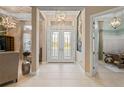 Bright and spacious entryway with double doors and high ceilings at 9044 Luna Ln, Sarasota, FL 34241