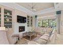 Light and airy living room with a fireplace and access to backyard at 9044 Luna Ln, Sarasota, FL 34241