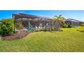 Screened pool and patio area with lush landscaping at 4606 Pond Brook Ct, Bradenton, FL 34211