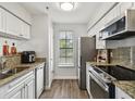 Brick courtyard with a fountain and lush landscaping at 1000 W Horatio St # 312, Tampa, FL 33606