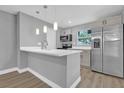 Modern kitchen with stainless steel appliances and an island at 3206 N 29Th St, Tampa, FL 33605