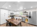 Modern kitchen with white cabinets, stainless steel appliances, and butcher block countertops at 1621 S Jefferson Ave, Clearwater, FL 33756