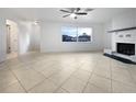 Spacious living area with tile floors and a fireplace at 5339 Brookmeade Dr, Sarasota, FL 34232