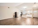 Spacious living area with laminate wood flooring and high ceilings at 11606 Nature Trl, Port Richey, FL 34668