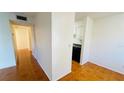 Hallway with tile flooring offering a view into the kitchen at 5504 Pokeweed Ct # 154, Tampa, FL 33617