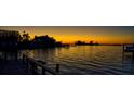 Peaceful sunset view over the water from a private dock at 103 Shore Dr, Dunedin, FL 34698