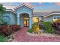 Welcoming entryway with double doors and a unique metal giraffe sculpture at 7419 Roxye Ln, Sarasota, FL 34240