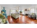 Spacious living room with hardwood floors, fireplace, and ample natural light at 3000 21St S Ave, St Petersburg, FL 33712