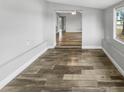 Open dining room with hardwood floors and access to kitchen at 5466 9Th N Ave, St Petersburg, FL 33710
