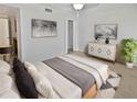 Spacious bedroom with a cozy bed, dresser, and plenty of closet space at 705 S Village N Dr # 205, St Petersburg, FL 33716