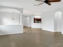 Spacious living room with tile floors and kitchen access at 407 Stone Briar Dr, Ruskin, FL 33570