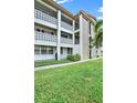 Condo building exterior with well-maintained landscaping at 4455 Duhme Rd # 205, St Petersburg, FL 33708