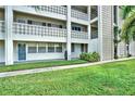 Condo building exterior showcasing landscaping and architectural details at 4455 Duhme Rd # 205, St Petersburg, FL 33708