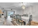 Dining room with table, chairs, and view into living room at 5711 Avista Dr # 4110, Sarasota, FL 34243