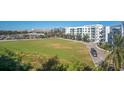 Large grassy area next to modern building at 4221 W Spruce St # 1407, Tampa, FL 33607