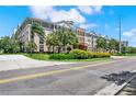 Building exterior, front view with landscaping at 4221 W Spruce St # 1407, Tampa, FL 33607