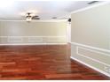 Spacious living room featuring hardwood floors and neutral walls at 3534 Player Dr, New Port Richey, FL 34655