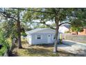 Single story home with a gray exterior, and a spacious yard at 510 S Disston Ave, Tarpon Springs, FL 34689