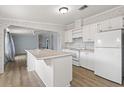 Bright kitchen featuring white cabinets and vinyl flooring at 3105 Beaver Creek Dr, Wesley Chapel, FL 33543