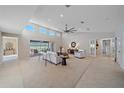 Bright and airy living room with high ceilings and neutral decor at 3770 Torrey Pines Blvd, Sarasota, FL 34238