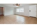 Bright living room with tile floors and ceiling fan at 1370 Leona Dr, Largo, FL 33770