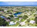 Bird's-eye view of the property, showcasing its canal-front location and neighborhood at 2917 Palm Dr, Punta Gorda, FL 33950