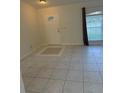 Home entryway with tile floor and neutral colors at 4666 Laramie Cir, North Port, FL 34286