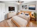 Bright bedroom with a comfortable bed, dresser, and large window at 9640 Mark Twain Ln, Port Richey, FL 34668