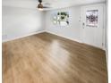 Spacious living room featuring light wood floors at 9640 Mark Twain Ln, Port Richey, FL 34668