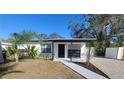 Charming house exterior with walkway and well-maintained lawn at 231 W Cornelius Cir, Sarasota, FL 34232