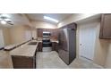 Updated kitchen featuring stainless steel appliances and a breakfast bar at 231 W Cornelius Cir, Sarasota, FL 34232