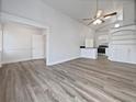 Open living room with hardwood floors and views into the kitchen area at 3030 46Th W Ave, Bradenton, FL 34207