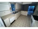 View of kitchen with access to the backyard at 23102 Maclellan Ave, Port Charlotte, FL 33980