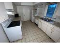 Bright kitchen with appliances and ample counter space at 23102 Maclellan Ave, Port Charlotte, FL 33980