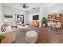Bright living room features hardwood floors, stylish furniture, and a neutral color palette at 3473 Parkridge Cir # 17-101, Sarasota, FL 34243