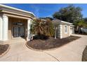 House entrance with columns, double doors and palm tree at 9373 Belvedere St, Spring Hill, FL 34608