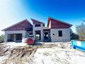 Block home under construction, showcasing unique roofline at 9468 Attica Cir, Port Charlotte, FL 33981