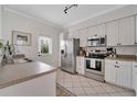Modern kitchen with stainless steel appliances and white cabinets at 2607 W Cleveland St # B, Tampa, FL 33609
