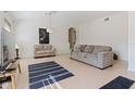 Comfortable living room features tile flooring, neutral colors, and contemporary furnishings at 12417 Adventure Dr, Riverview, FL 33579