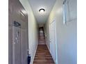 Welcoming hallway with wood floors, leading to stairs and interior doors at 10412 Villa View Cir # 10412, Tampa, FL 33647