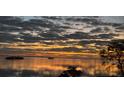 A gorgeous sunset view from the property, overlooking a tranquil bay at 1813 Mariner Dr # 152, Tarpon Springs, FL 34689