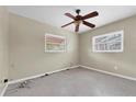 Vacant bedroom with two windows and a ceiling fan at 2817 Miriam S St, Gulfport, FL 33711