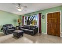 Inviting living room features a large window, comfortable seating, and natural light at 3084 Williamsburg St, Sarasota, FL 34231