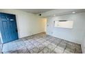 Inviting living room with tiled floors and a passthrough to the kitchen for easy entertaining at 7120 Waterside Dr # 106, Tampa, FL 33617