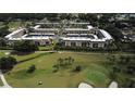 Aerial view of condo community surrounding a golf course, offering a serene and recreational lifestyle at 12300 Vonn Rd # 7203, Largo, FL 33774